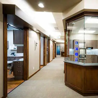 A hallway with a view of Operatory rooms and the lab at Coulter Family Dentistry 