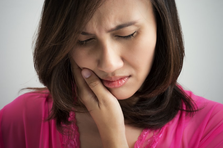 A woman suffering from TMJ pain in Spokane Valley, WA