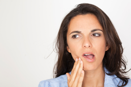 Brunette woman with tooth ache hand on mouth